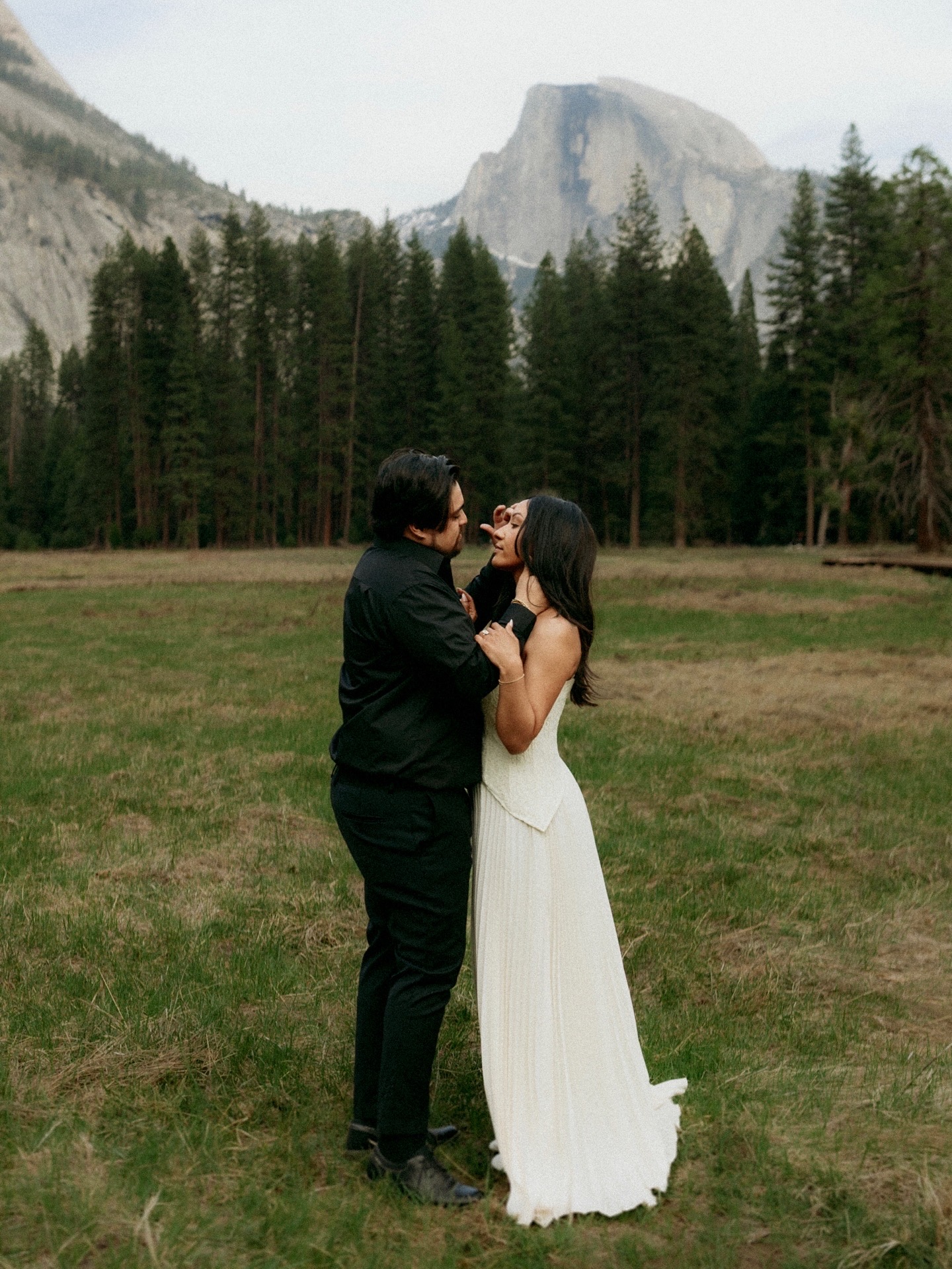 Tamara and Christian embracing with Half Dome in the background